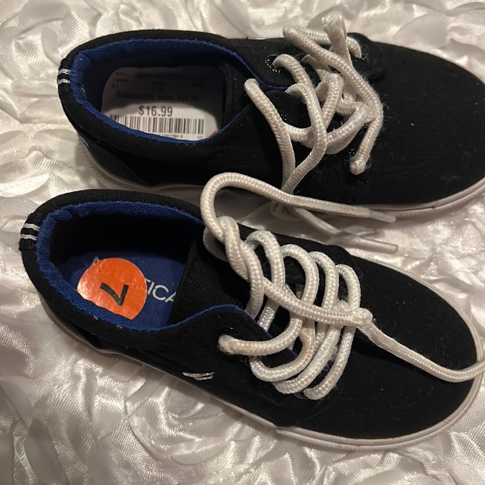 Brand new Size 7 Nautical shoes with stickers still on.
